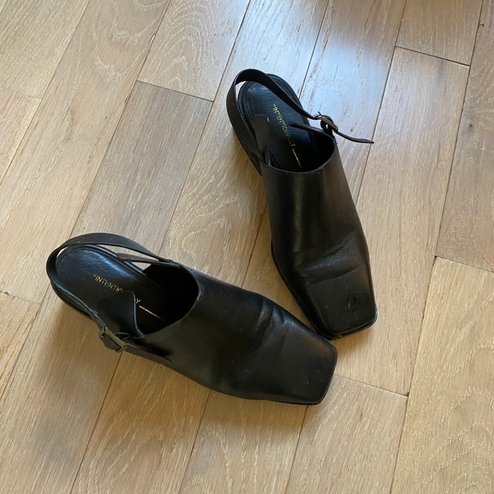 Intentionally Blank black leather strapped mules